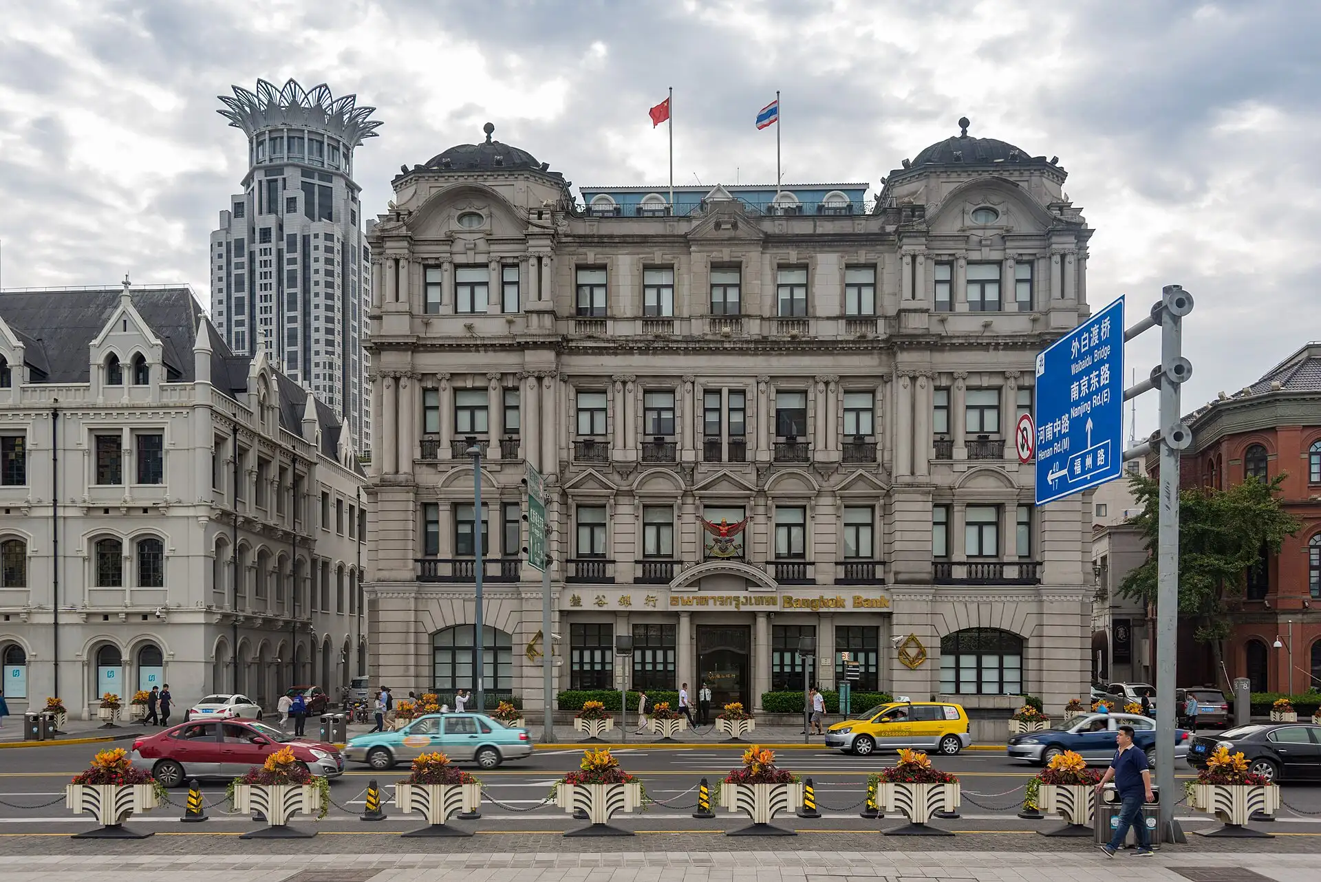The Great Northern Telegraph Building, a white Baroque façade with a mansard roof, on the Bund.