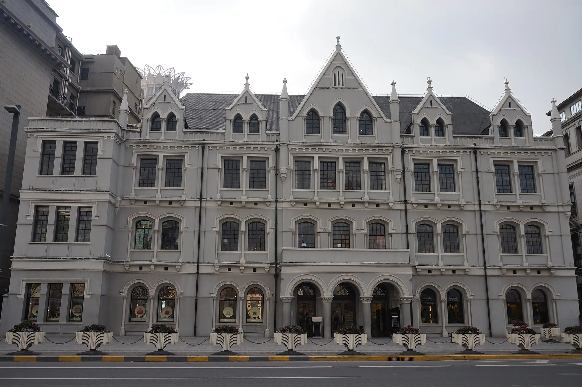 The former Imperial Bank of China building, a Gothic stone façade with pointed gables.