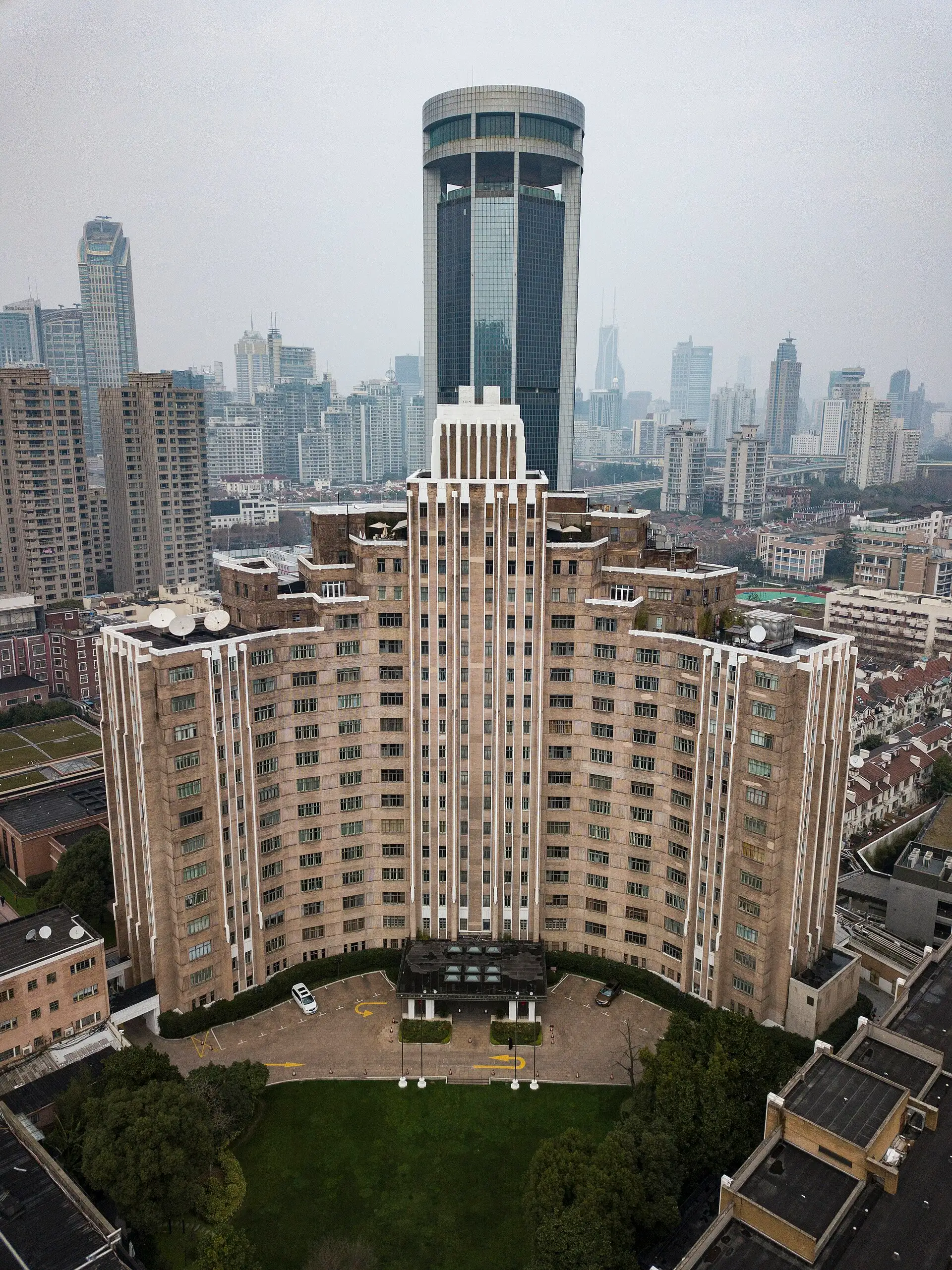 The Jin Jiang Hotel's stepped tower seen from above, with its garden below.