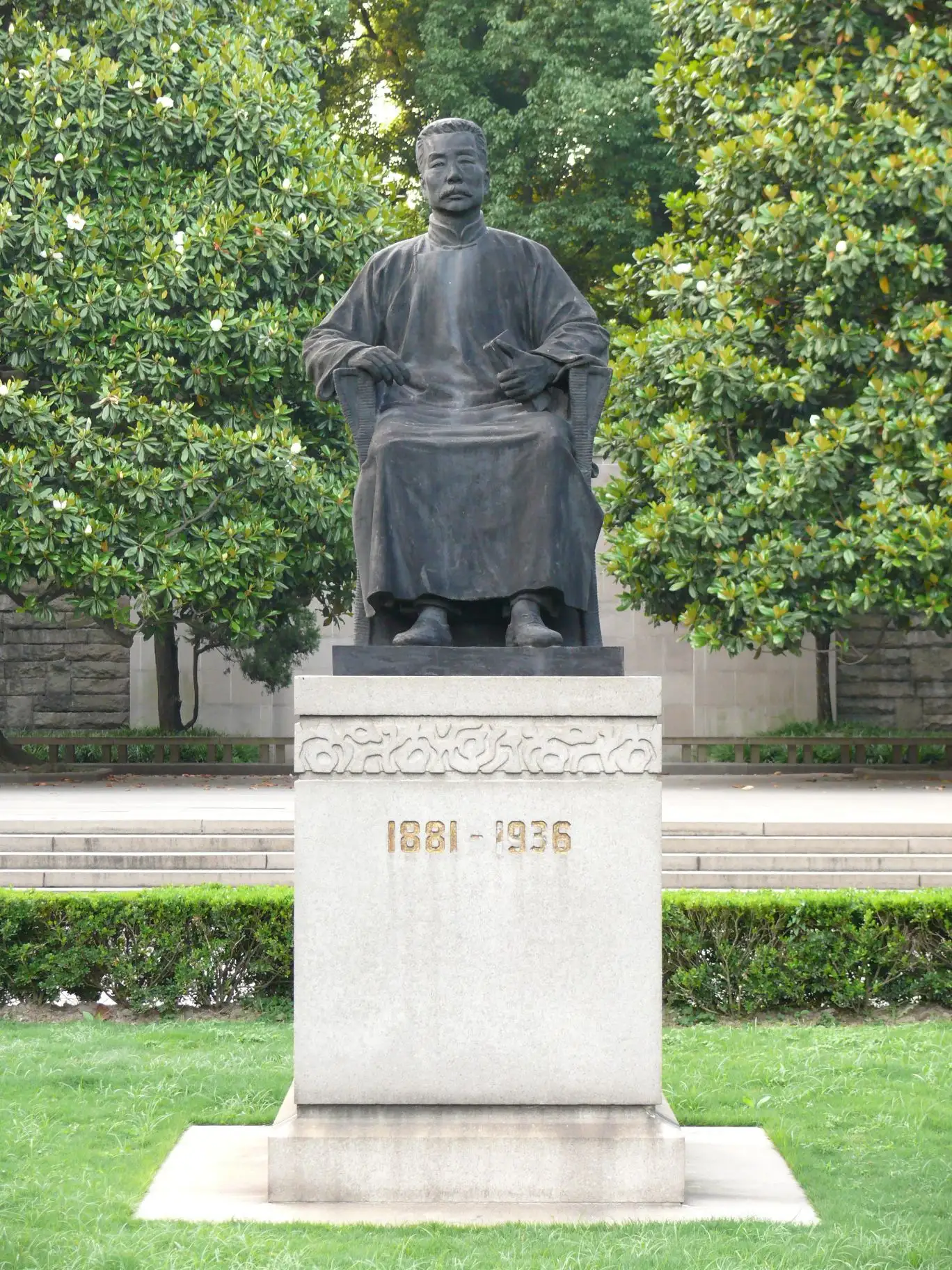 The bronze statue of Lu Xun, seated, in Lu Xun Park.