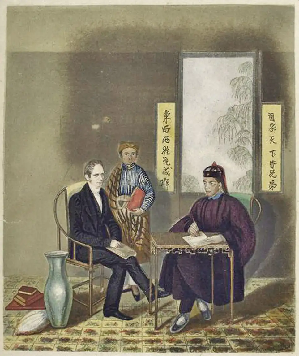 Hand-coloured print of a seated European man in a black coat beside a Chinese man writing at a table, with a young man standing between them.