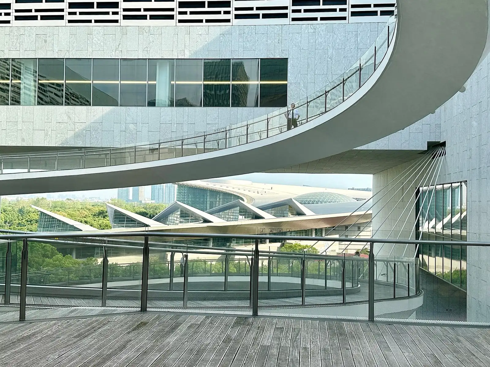 The curved exterior balcony and glazed facade of Shanghai Museum East.