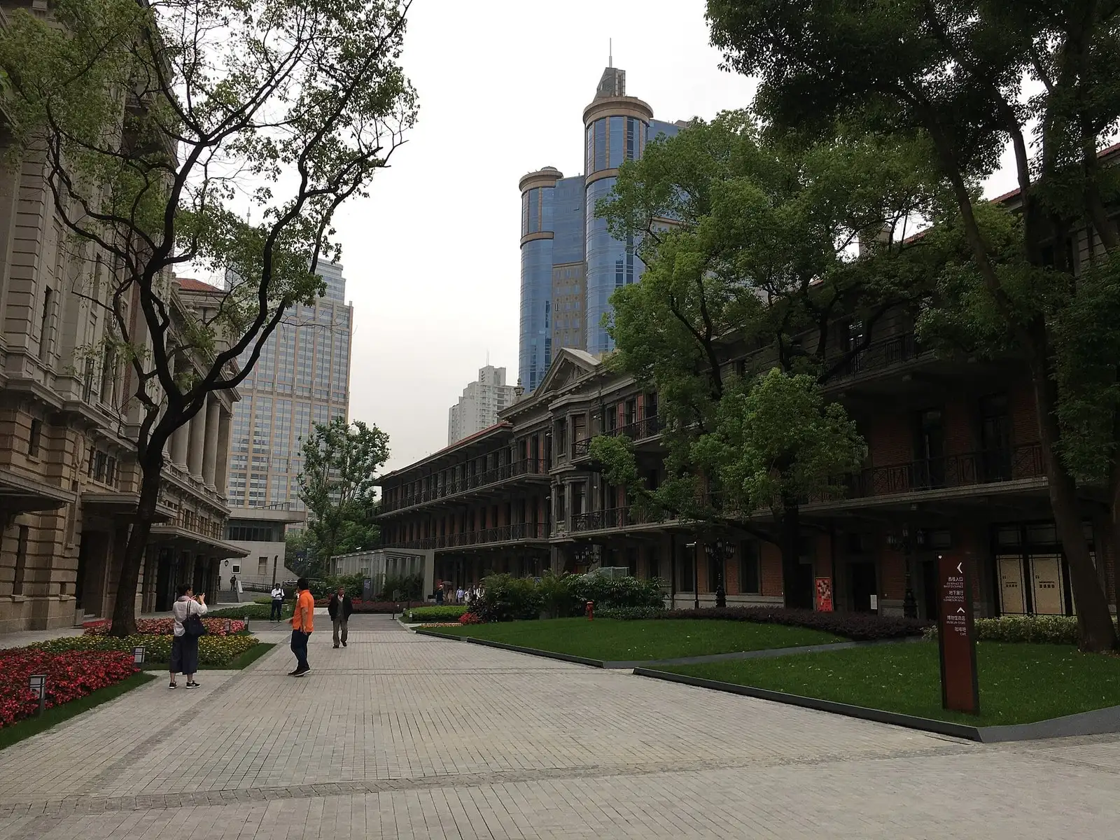 The former race club building at Shanghai History Museum, with a lawn, arched ground-floor windows and a clock tower.