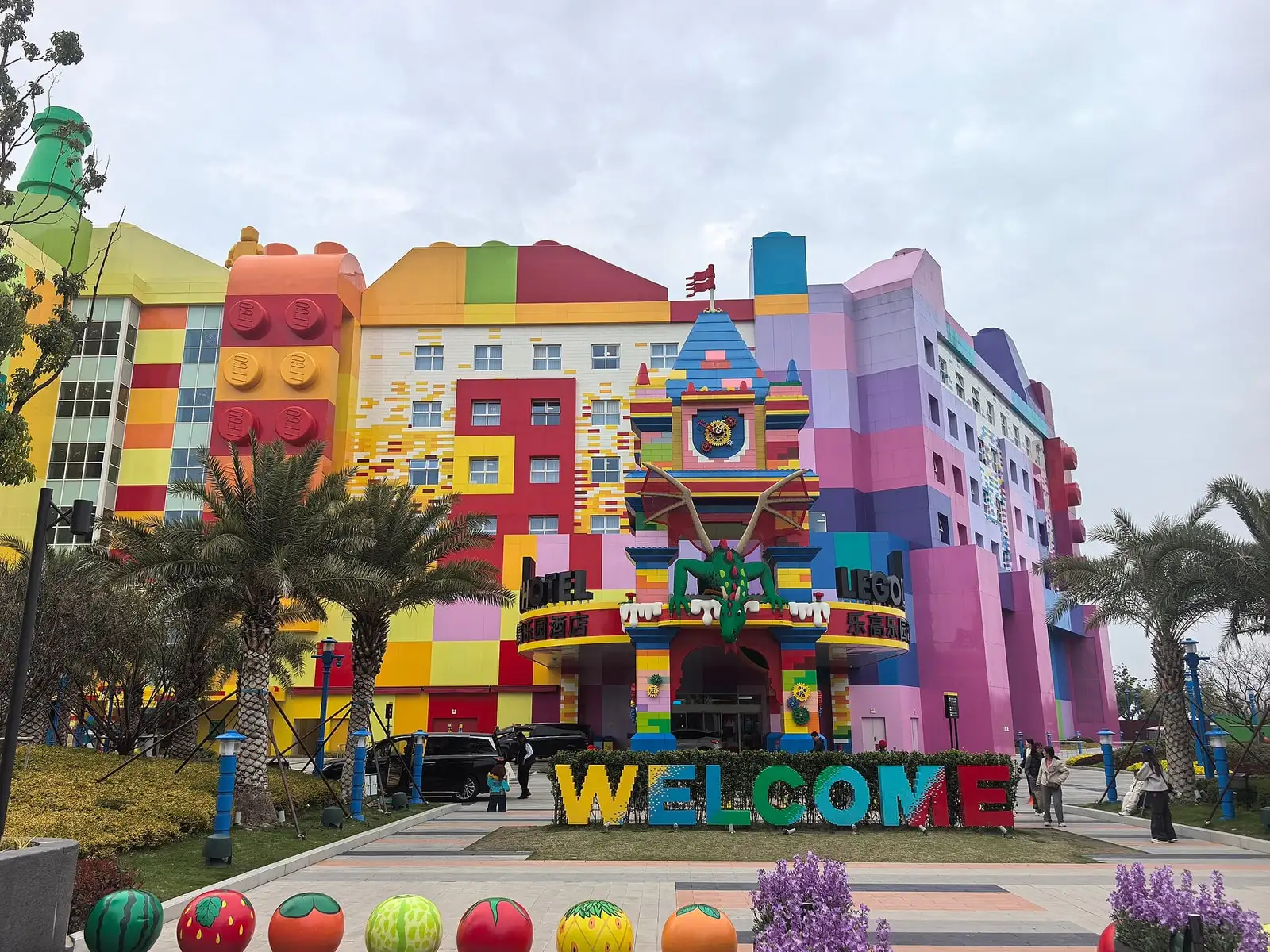 The colourful facade of Legoland Shanghai Hotel, with block-shaped decorations and a large welcome sign.